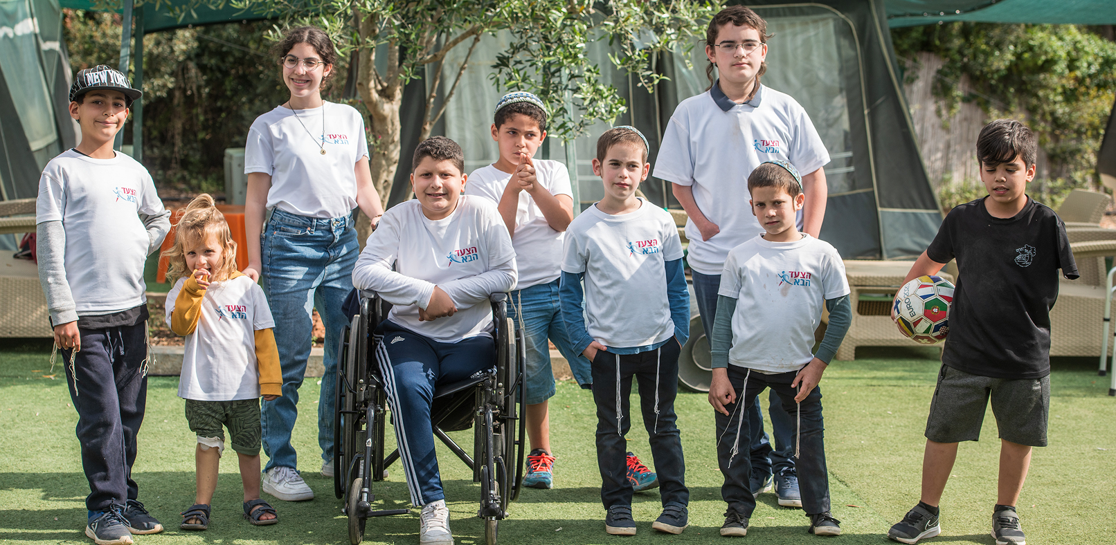 A group of children from the Next Step community standing together
