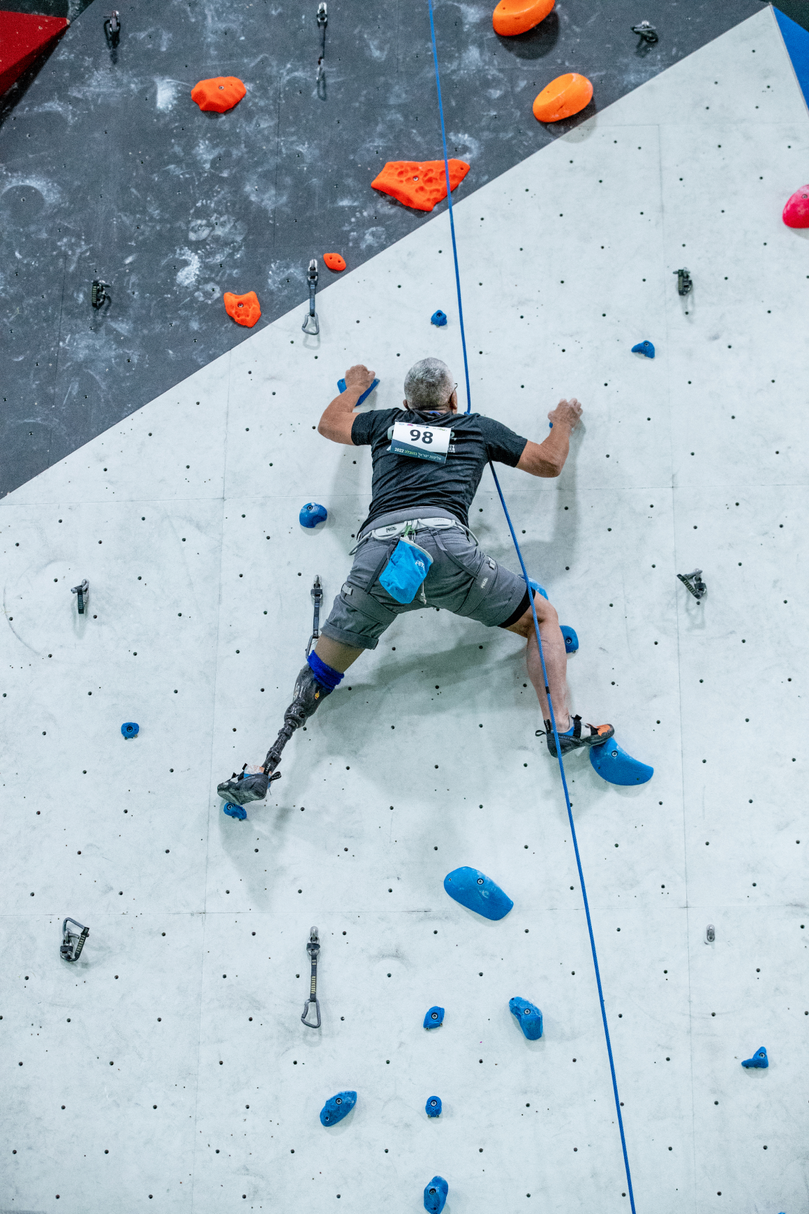 An amputee rock climbing