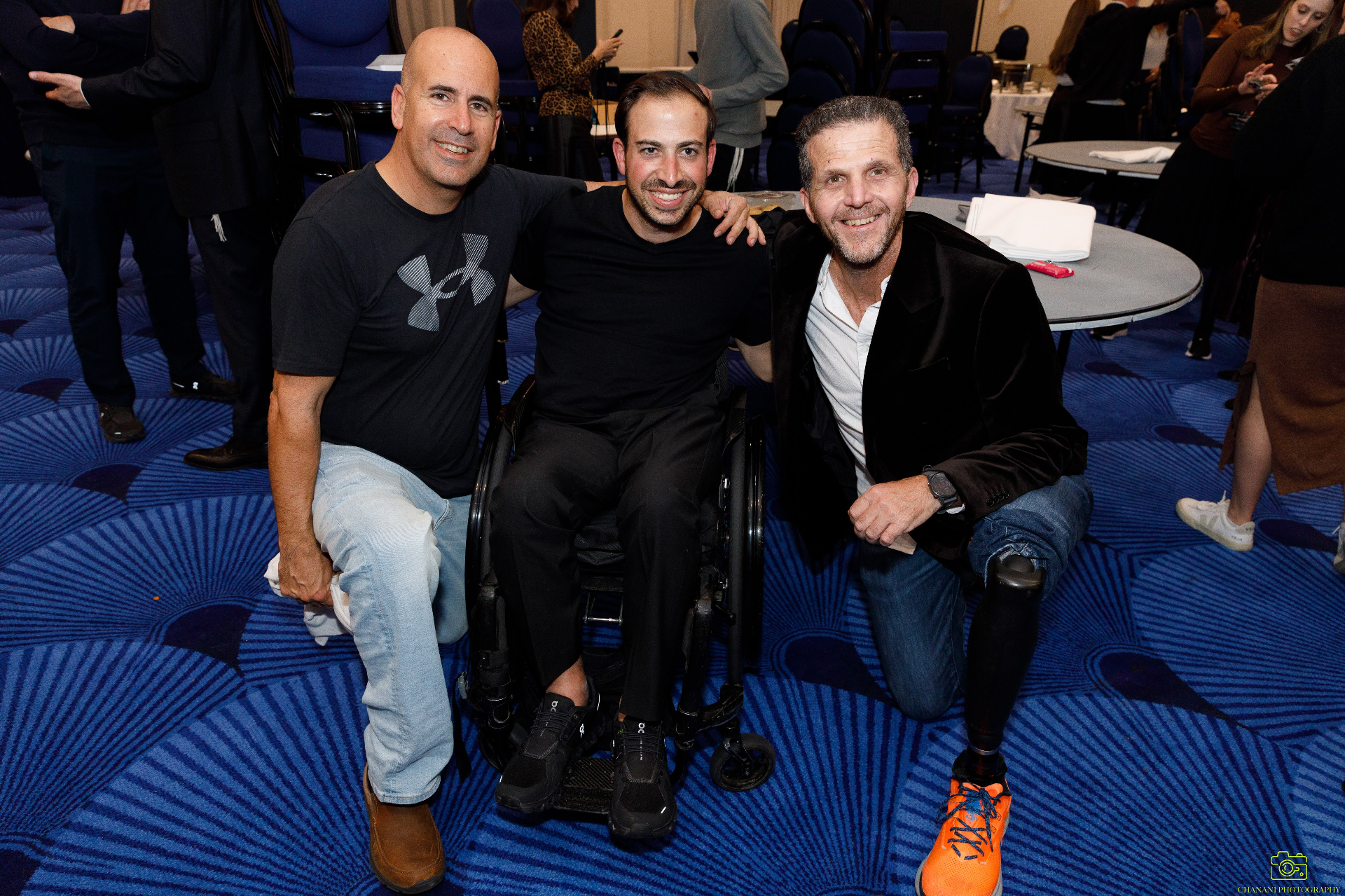 Three friends together at a community event